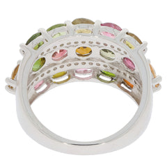Elegant oval multiple color tourmaline sterling silver ring showcasing a sparkling gemstone accent on a polished band.