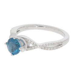 Round blue London Topaz sterling silver ring with accent stones, showcasing elegance and luxury.