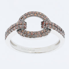 Elegant sterling silver ring with sparkling brown gemstones in a unique interlocking design.