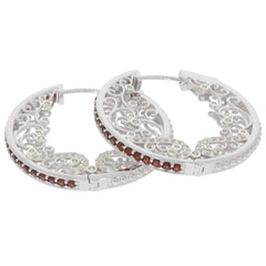 Round red garnet sterling silver earrings featuring intricate filigree design and sparkling accents.