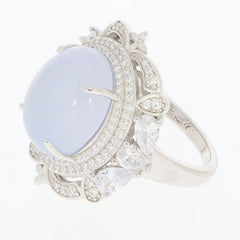 Oval white opal sterling silver ring with sparkling moissanite accent and intricate setting.
