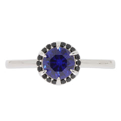 Blue Sapphire sterling silver ring with accent, featuring a round gemstone and sparkling details.