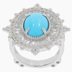 Oval blue turquoise sterling silver ring with sapphire accents and intricate detailing.