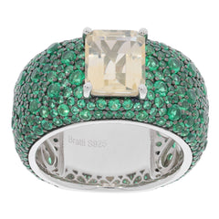 Elegant yellow Moissanite ring with emerald accents in sterling silver setting.