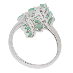 Back view of an elegant oval green emerald sterling silver ring with multiple accents.