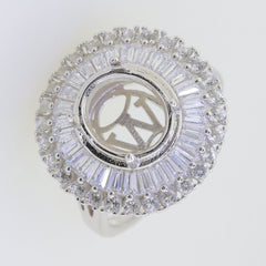 Sterling silver semi mount ring setting with oval halo of white topaz and baguette gemstones, main stone not included.