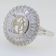 Sterling silver semi mount ring setting with baguette halo and white topaz, designed for 12x10mm oval gemstone.