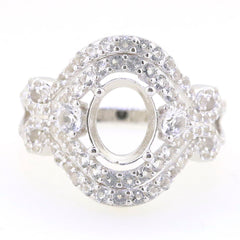 Sterling silver semi mount ring setting with double halo for oval 9x7mm gemstone, featuring White Topaz accents.