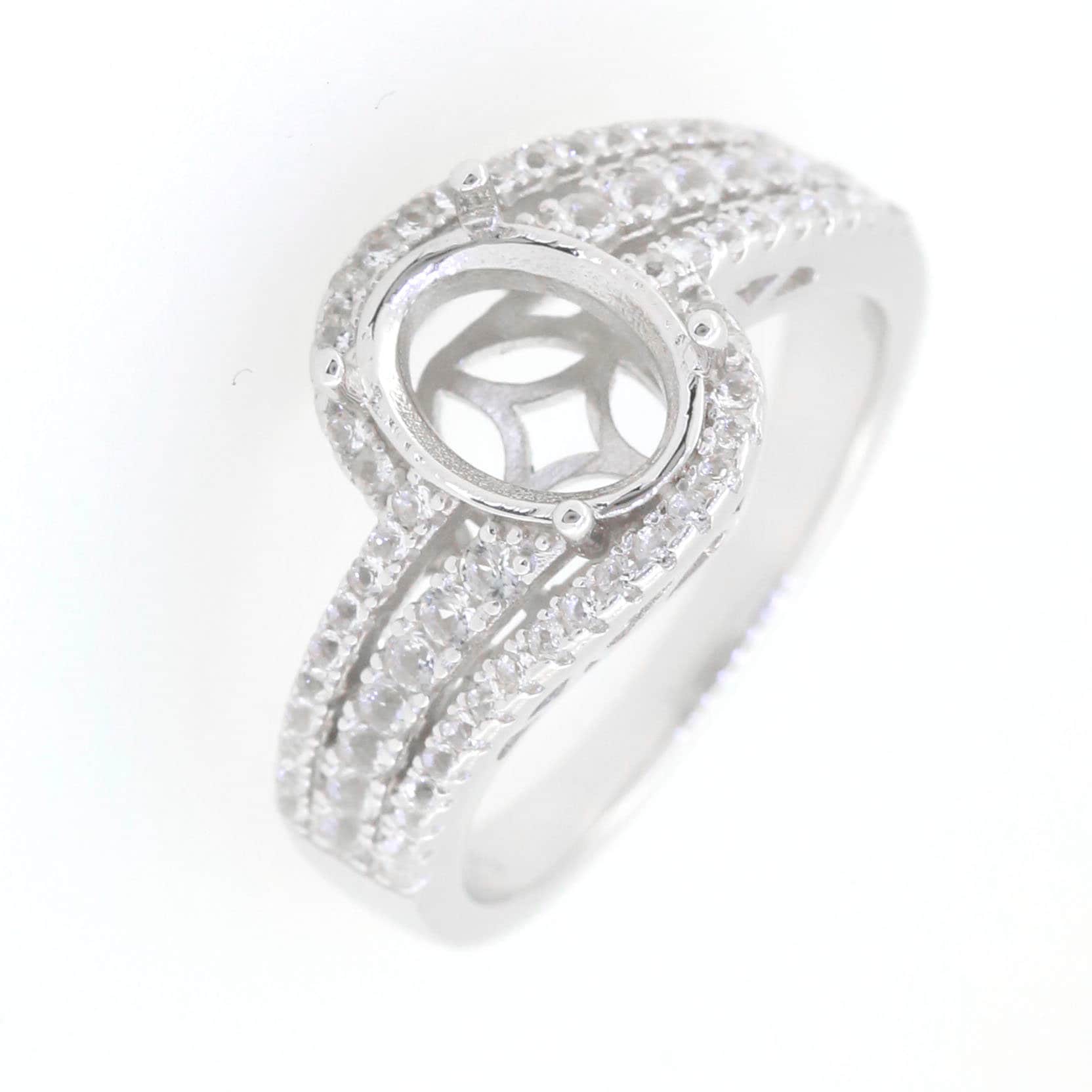 Sterling silver semi mount ring setting with oval 9x7mm halo and white topaz gemstones.