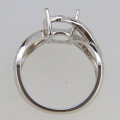 Sterling silver semi mount ring setting with split shank for round gemstone, featuring black spinel accent.