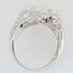 Sterling silver semi mount cocktail ring setting with white topaz accents, designed for multiple stones, seen from the side.