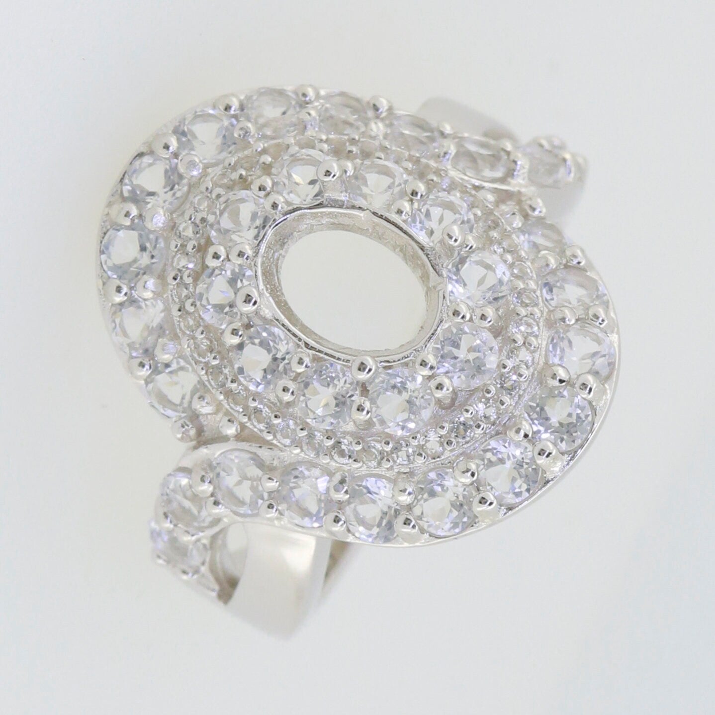 Sterling silver semi mount ring setting with twisted shank and double halo design featuring white topaz accents.