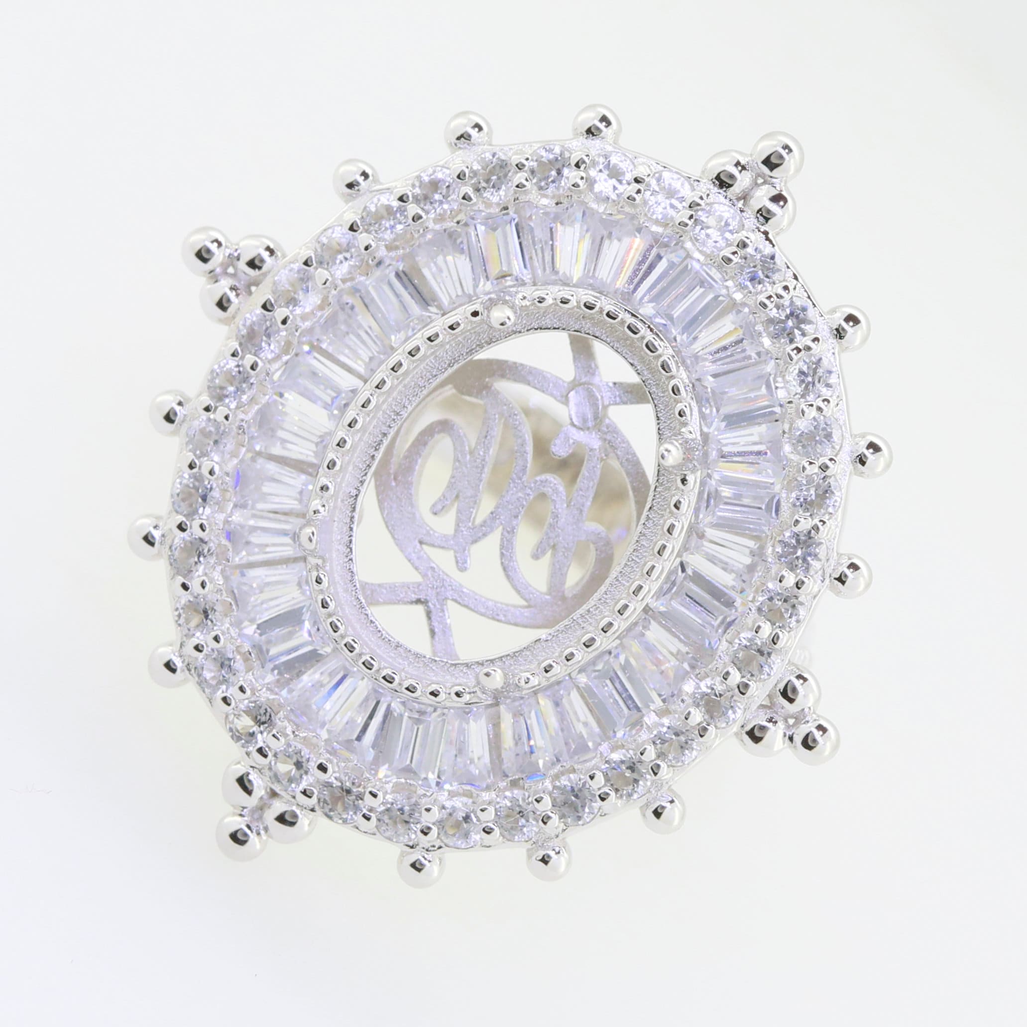 Sterling silver semi mount ring setting with oval design for 14x10mm gemstone, adorned with sparkling white topaz.