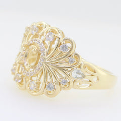 Gold ring setting with ornate filigree design and sparkling white gemstones, perfect for semi mount rings.