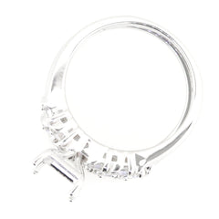 Sterling silver semi mount ring setting with white topaz gemstones, designed for a 9x7mm emerald centerpiece.