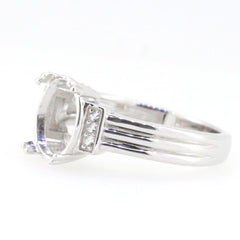 Sterling silver semi mount ring setting with white topaz accents, designed for an oval 10x8mm gemstone.
