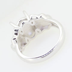Sterling silver semi mount ring setting, designed for 11x8mm oval cabochon gemstone, showcasing elegant contours.