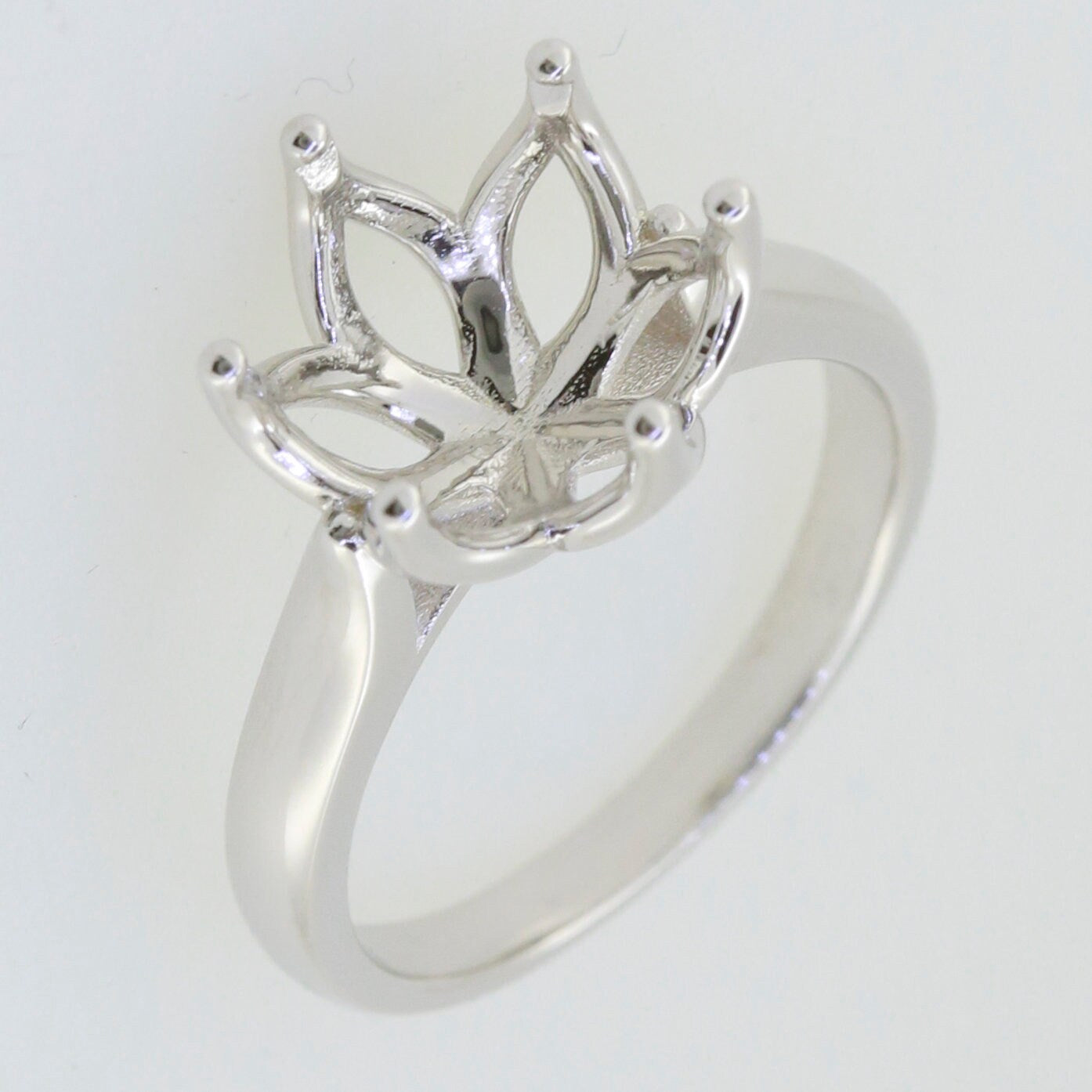 Sterling silver tulip head semi mount ring setting for custom gemstone installation.