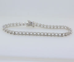 Sterling silver semi-mount tennis bracelet setting with stainless steel tongue, designed for customizable gemstone placement.