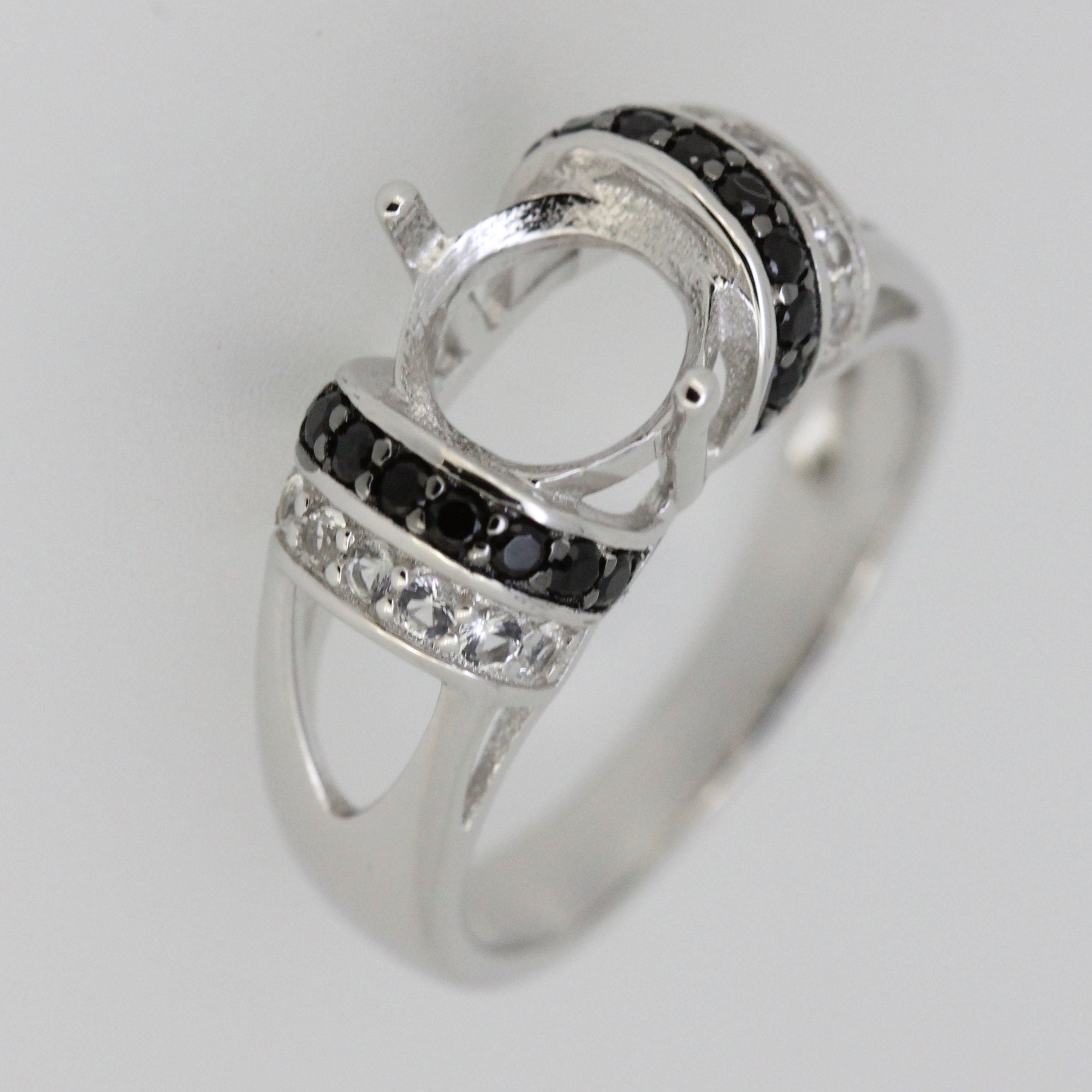 Sterling silver semi mount ring setting featuring black spinel and white topaz accent gemstones.
