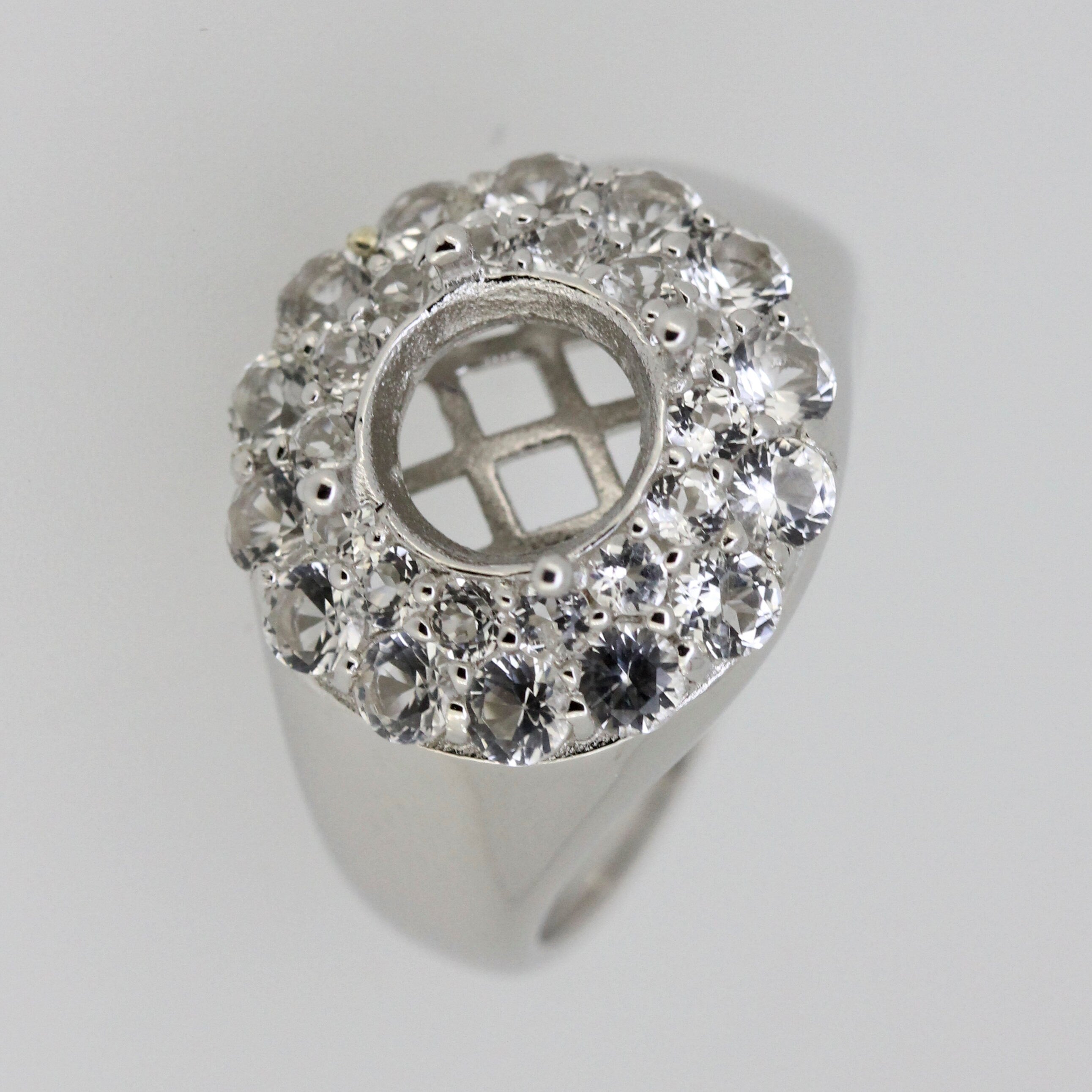 Sterling Silver semi mount ring setting with round double halo and white topaz accent, designed for customized gemstone settings.