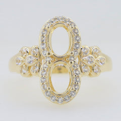 Elegant gold ring with dual oval settings and sparkling stones, perfect for a stylish and unique accessory.