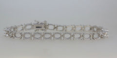 Sterling Silver semi mount tennis bracelet setting with oval links, perfect for custom gemstone placement.