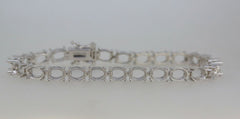 Sterling Silver Semi Mount Tennis Bracelet Setting with oval stone mounts for customizable gemstone options.