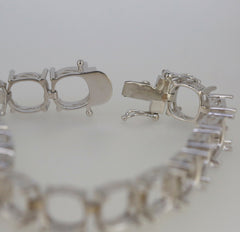 Close-up of sterling silver tennis necklace clasp and setting, showcasing the detailed craftsmanship and stainless steel tongue.