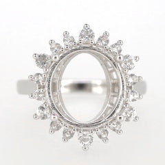 Sterling silver semi mount ring setting with halo and white topaz for 14x12mm oval gemstone.