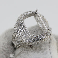 Sterling silver semi mount ring setting with white topaz accents, designed for a 14x10mm emerald gemstone.