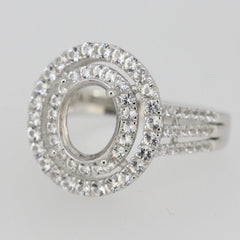 Sterling Silver semi mount ring setting with oval halo and white topaz accents, ideal for customized engagement rings.