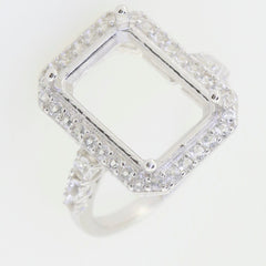 Custom sterling silver semi mount ring setting with white topaz accent for 12x10mm emerald, halo design.