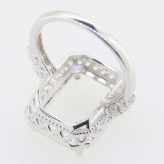 Sterling silver semi mount ring setting for 14x10mm emerald with intricate double halo design.