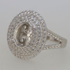 Sterling silver semi mount ring setting with triple halo of white topaz, oval center for custom gemstone placement.