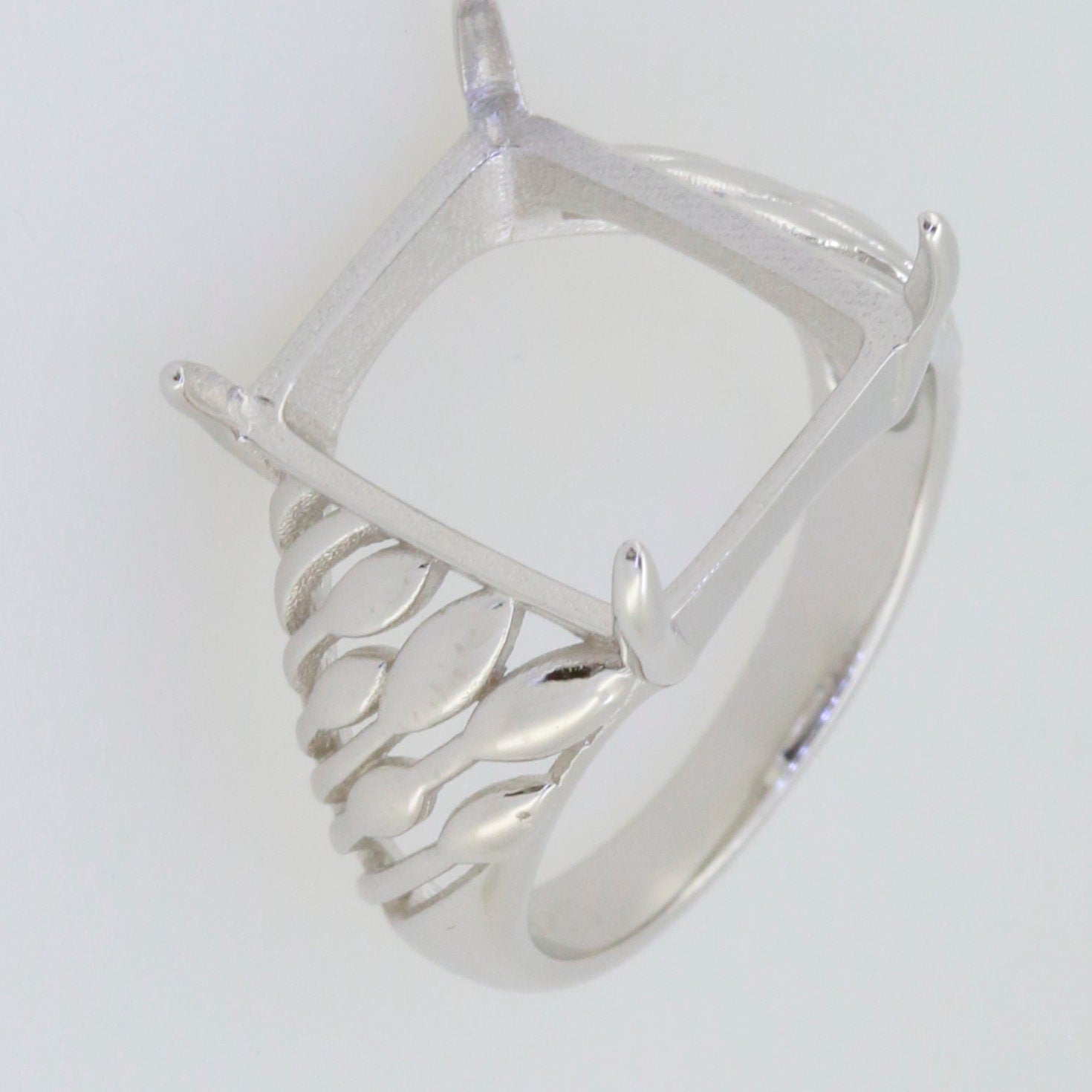 Sterling Silver Semi Mount Ring Setting for 14x12mm Cabochon with elegant twisted band detailing.