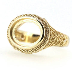 Sterling silver semi mount ring setting featuring oval filigree milgrain design for cabochon gemstones.