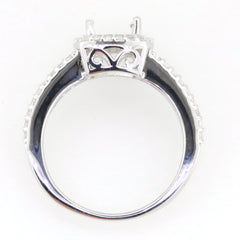 Sterling silver semi mount ring setting with halo design and space for oval gemstone, featuring white topaz accent options.
