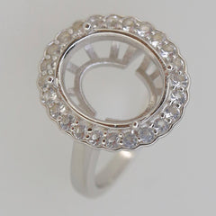 Sterling silver semi mount ring setting with halo and moissanite accents for oval gemstone 14x12mm.