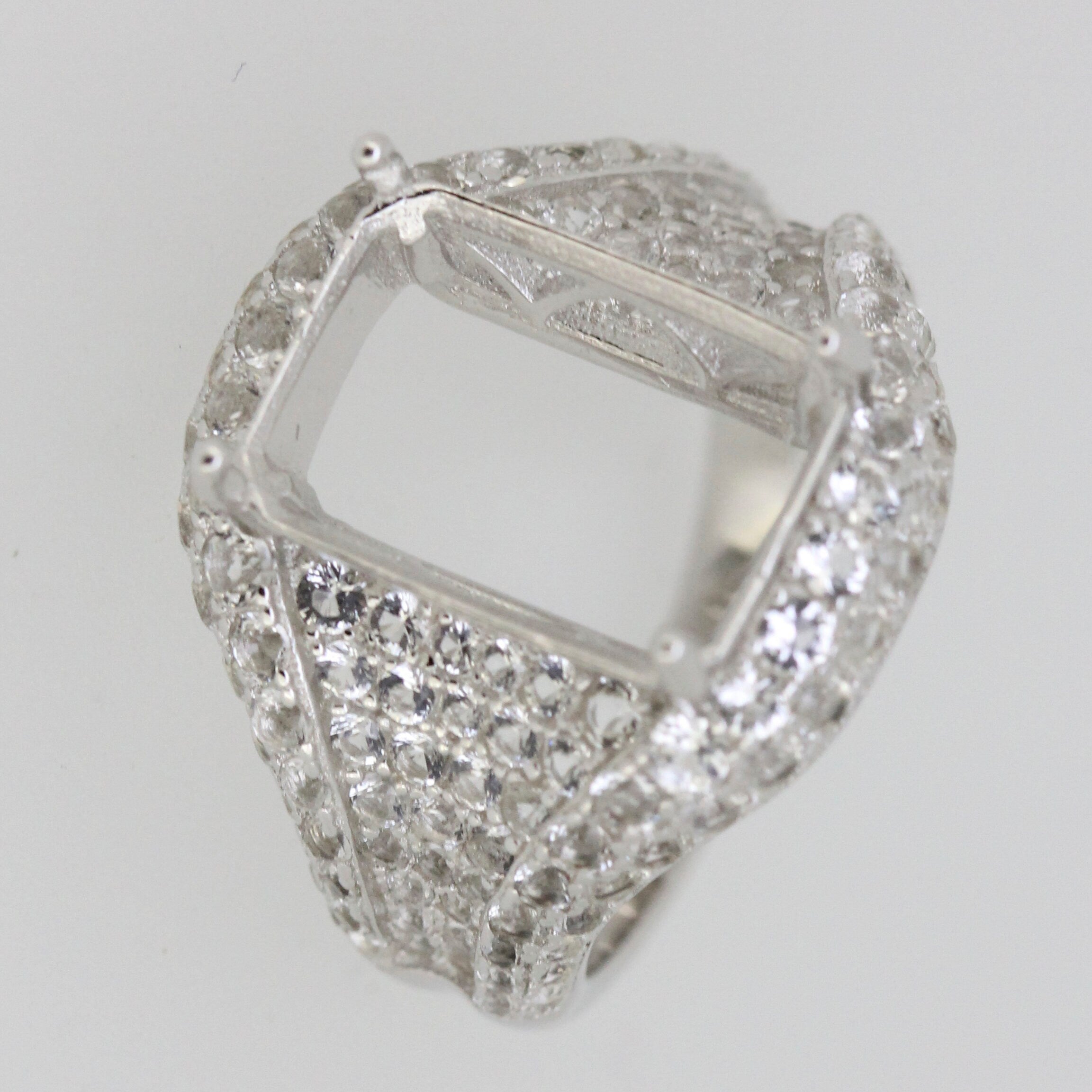 Sterling Silver Semi Mount Ring Setting with White Topaz accents, designed for an emerald 14x10mm gemstone.