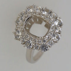 Sterling silver semi mount ring setting with white topaz accents, designed for a cushion cut gemstone, halo style.