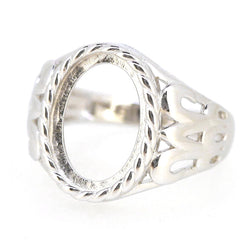 Sterling silver semi mount ring setting for 14x10mm oval cabochon, featuring intricate design and white topaz.