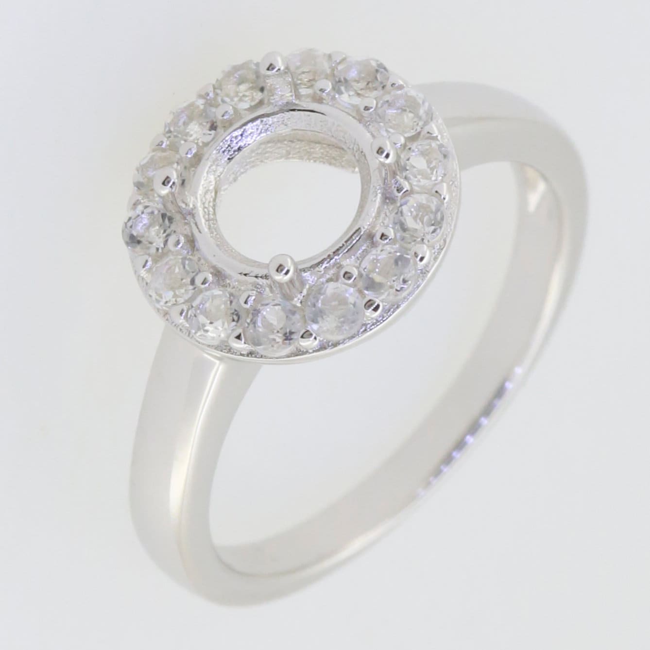 Sterling silver semi mount ring setting with halo of D color moissanite accents, designed for 7x7mm center stone.