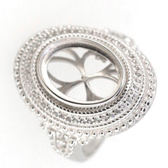 Sterling silver semi mount ring setting with halo design for 11x9mm oval cabochon, featuring intricate milgrain detail.