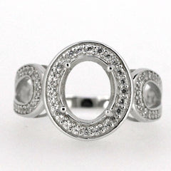 Sterling silver semi mount ring setting featuring an oval center, adorned with white topaz accents for a sparkly touch.