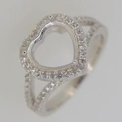 Sterling Silver heart-shaped semi-mount ring setting with white topaz accents, designed for custom gemstone placement.