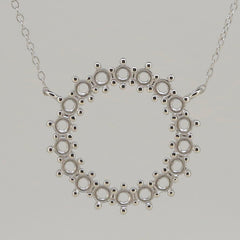 Sterling silver semi mount pendant setting with loops for multi stones and an 18" chain, featuring white topaz.
