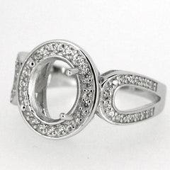 Sterling silver semi mount ring setting featuring an oval center and white topaz accent stones.