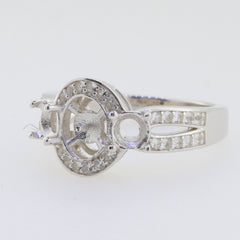 Sterling silver semi mount ring setting with three stones and a round 7x7mm pearl space for customization.