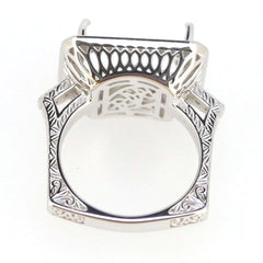 Sterling silver semi mount ring setting with intricate design for 16x12mm cushion cut stones, featuring white topaz accents.